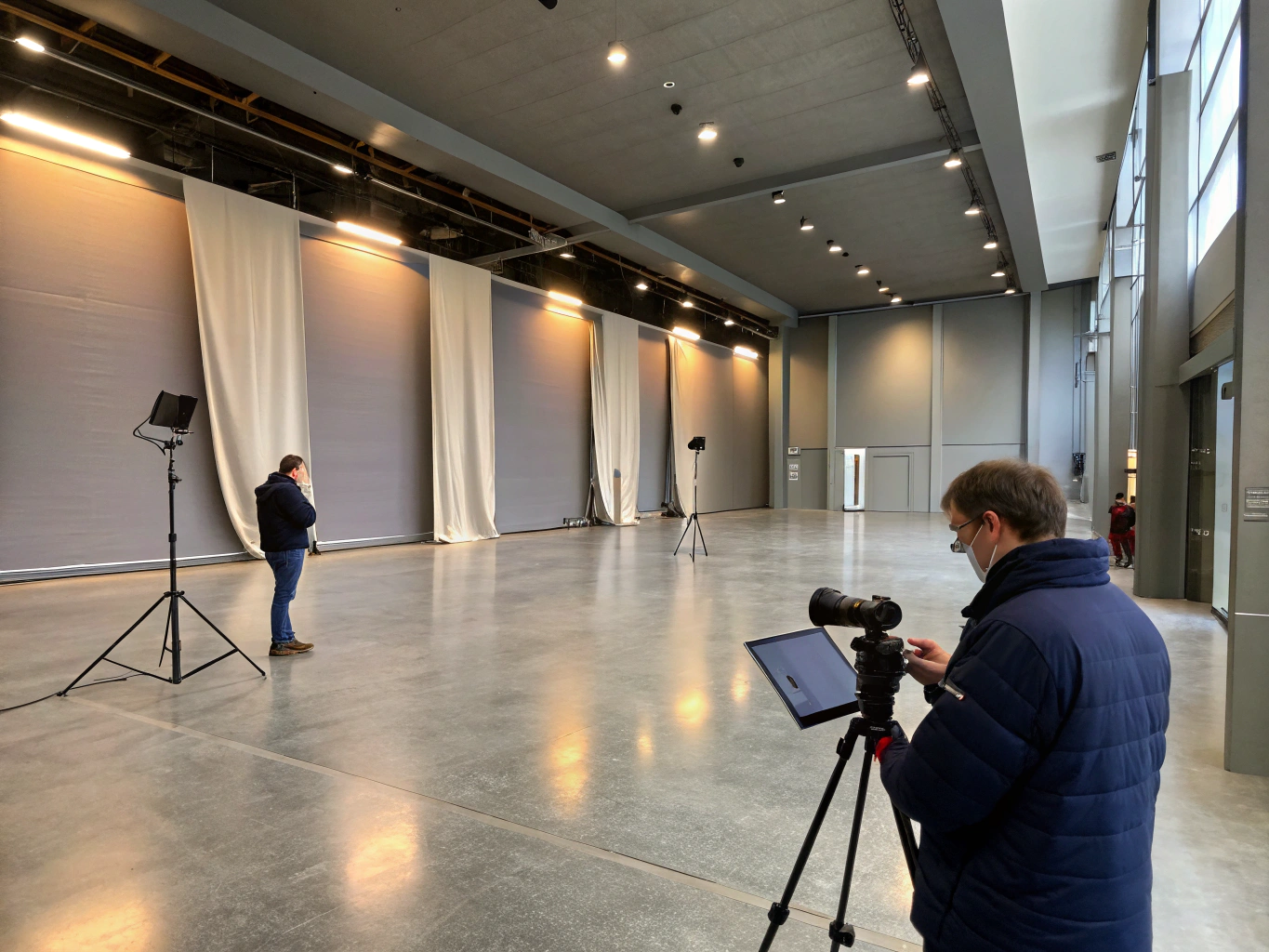 Industrial warehouse space transformed into a creative set with high ceilings and customizable design elements.