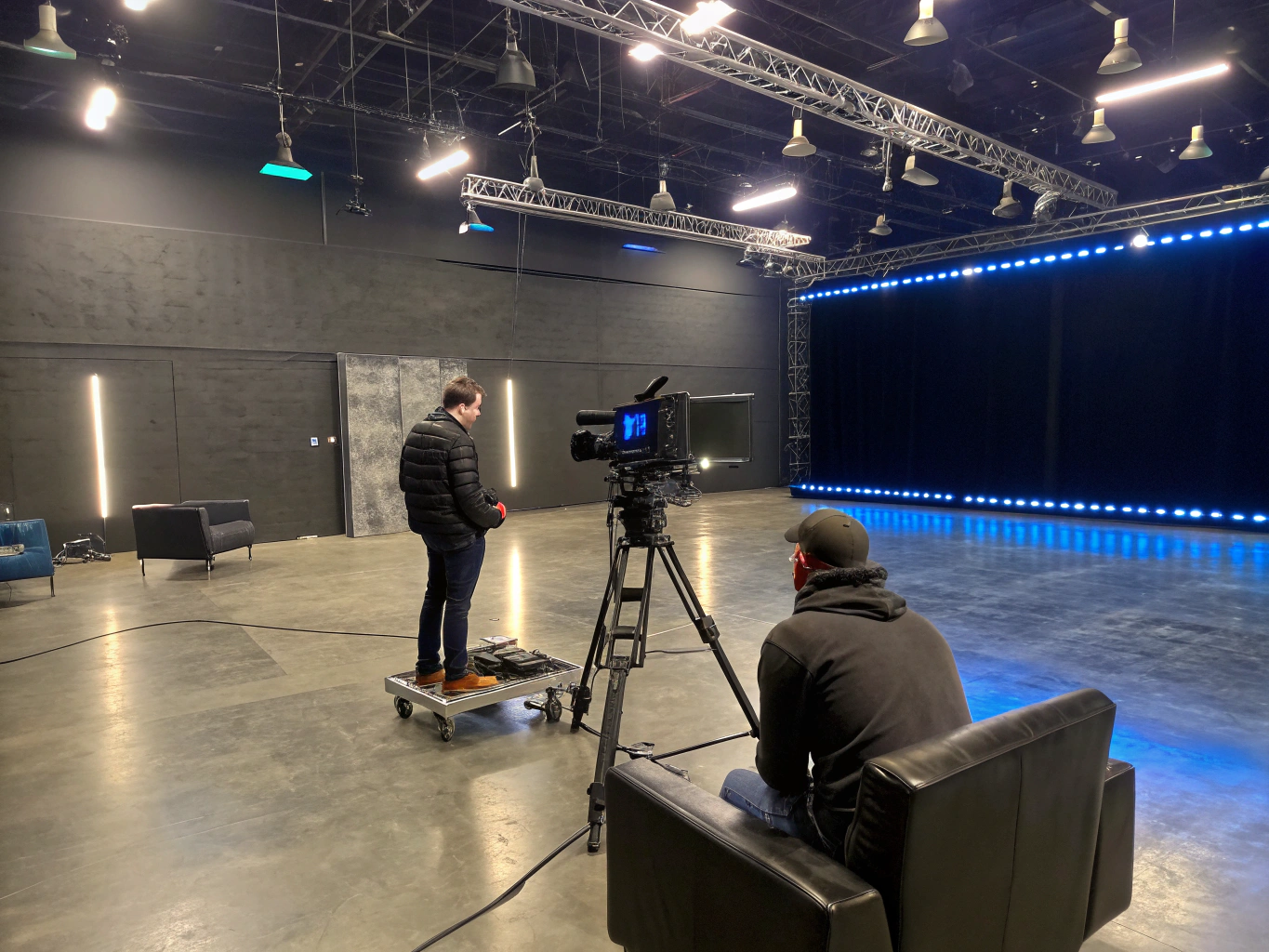 Secure shipping container unit equipped for professional camera and lighting equipment storage with climate control and organized shelving systems.